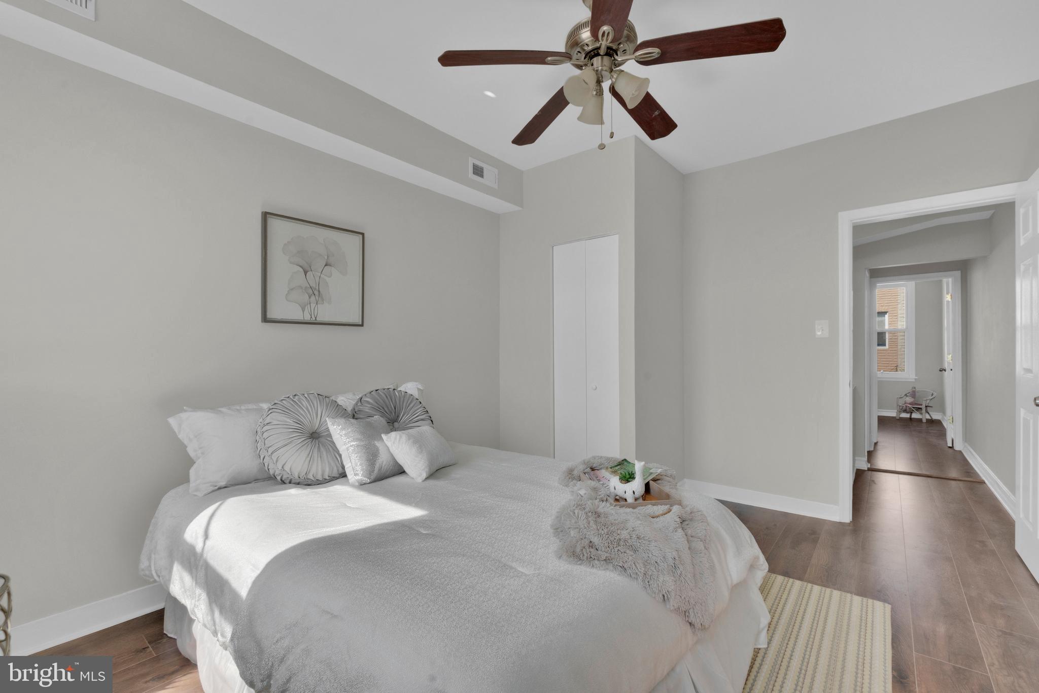 255 South Conkling Street Baltimore, MD 21224 - Photo 24 of 33 a bedroom with a bed and a chandelier