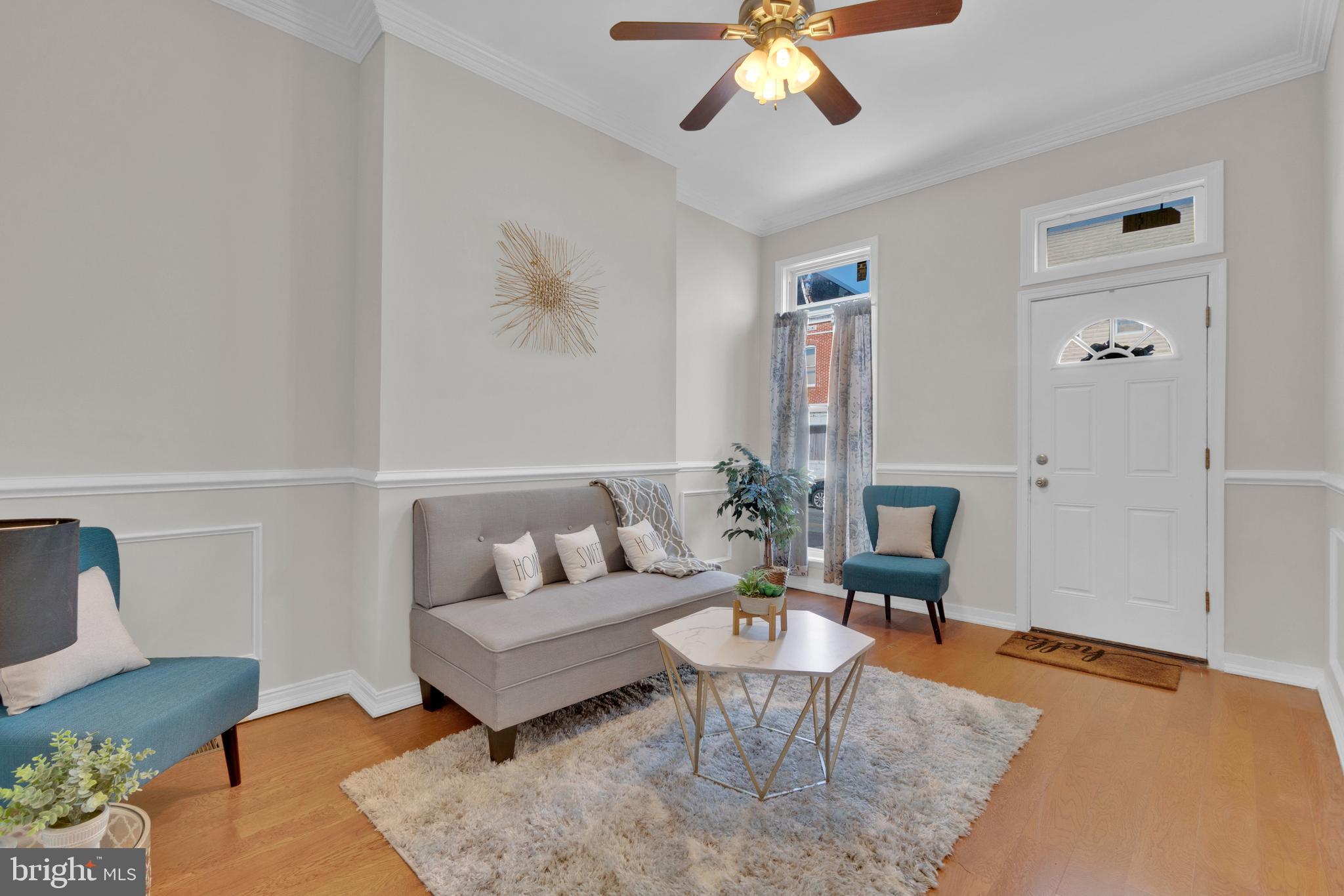 255 South Conkling Street Baltimore, MD 21224 - Photo 8 of 33 a living room with furniture and a rug