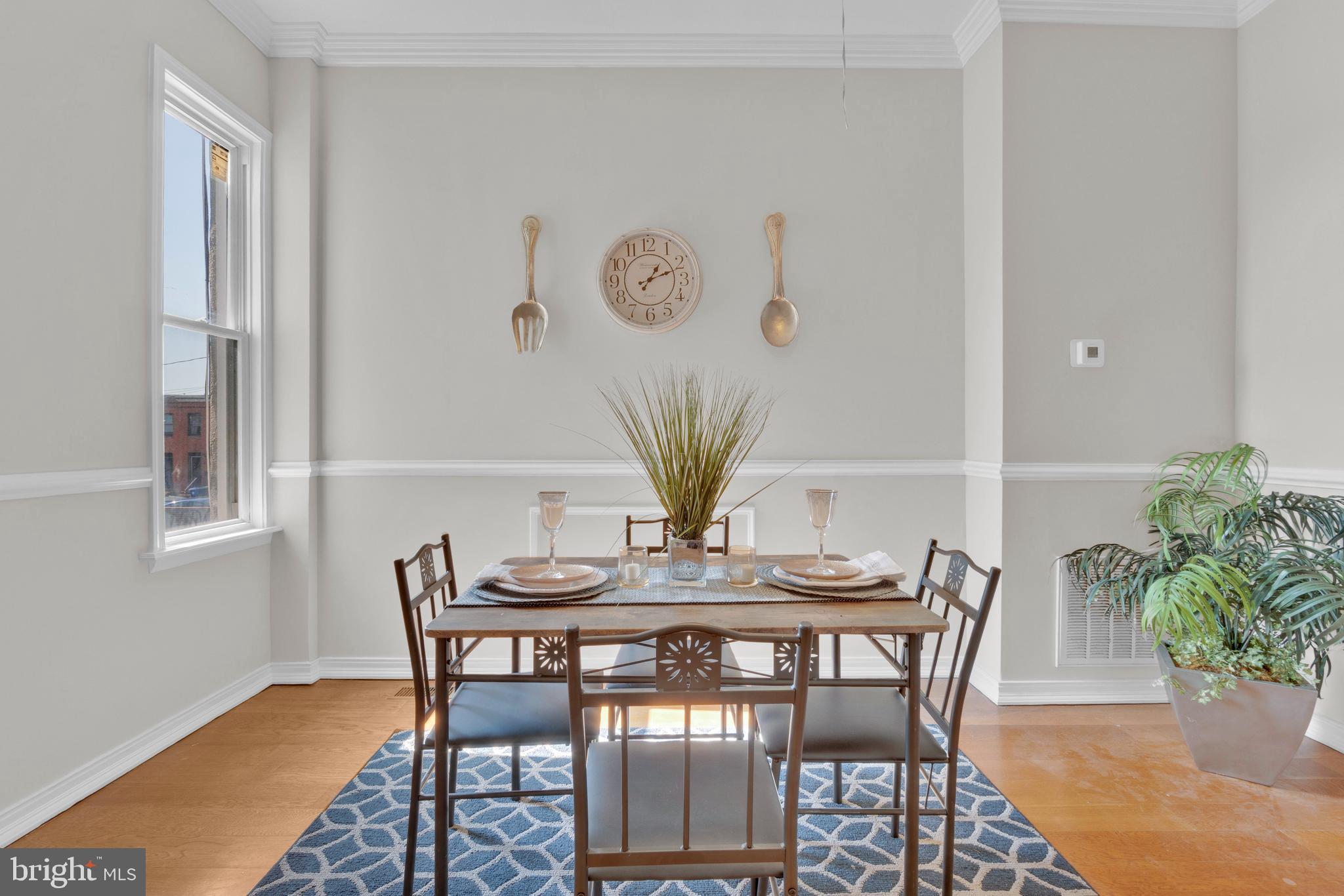 255 South Conkling Street Baltimore, MD 21224 - Photo 10 of 33 a view of a dining room with furniture and wooden floor