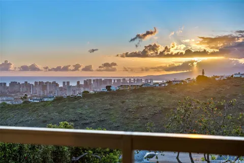 a view of a big yard with an outdoor seating