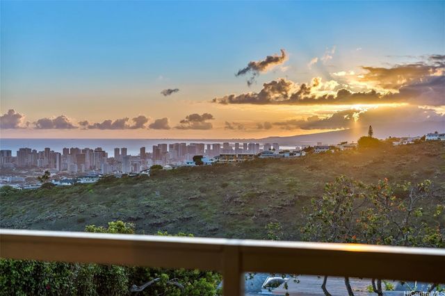 a view of a big yard with an outdoor seating