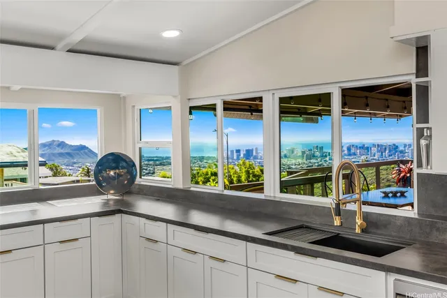 a kitchen with a sink and a large window