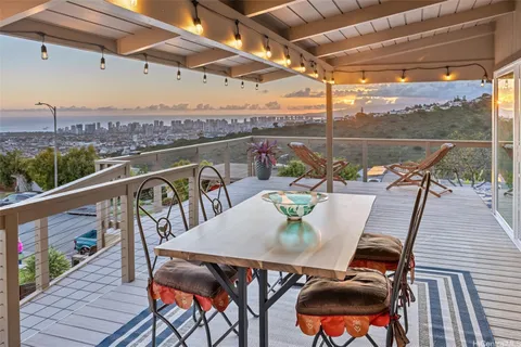 a balcony with wooden floor