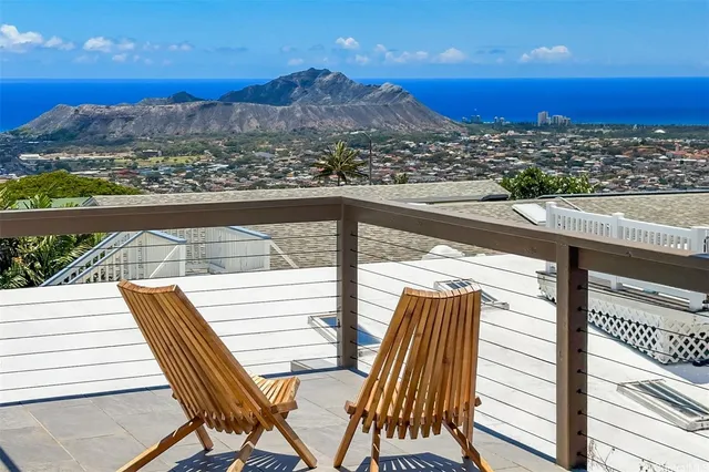 a view of a balcony with an ocean view