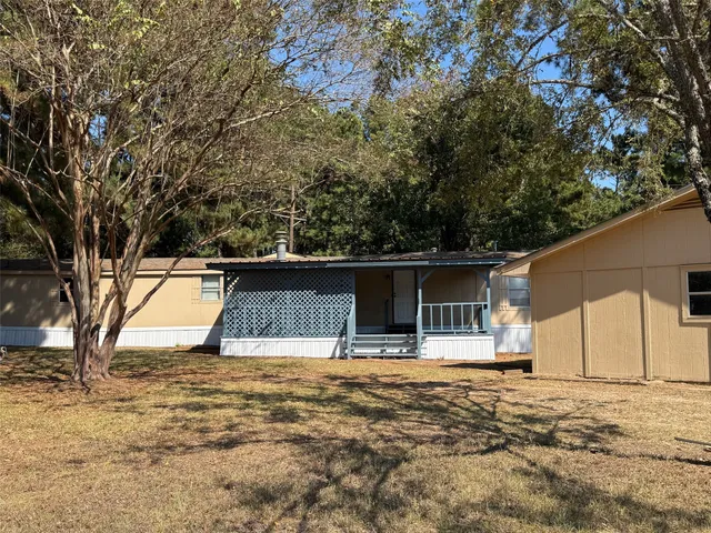 a house with trees in front of it