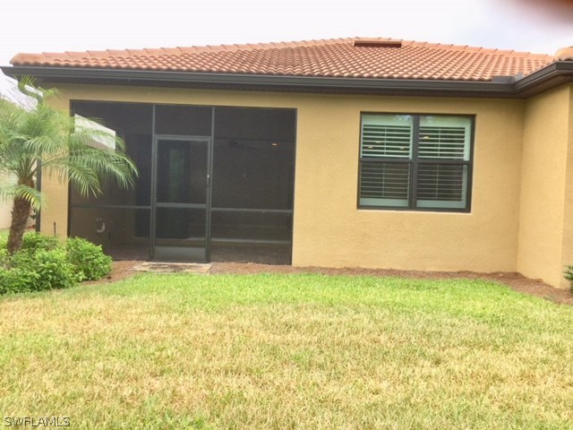10840 Dennington Road Fort Myers, FL 33913 - Photo 34 of 35 a view of a house with a yard