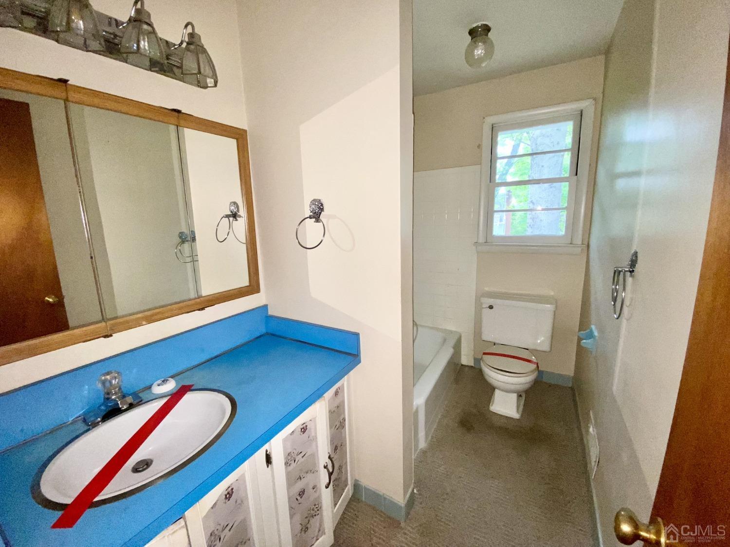 12 Federal City Road Ewing, NJ 08638 - Photo 5 of 16 a bathroom with a toilet sink and mirror