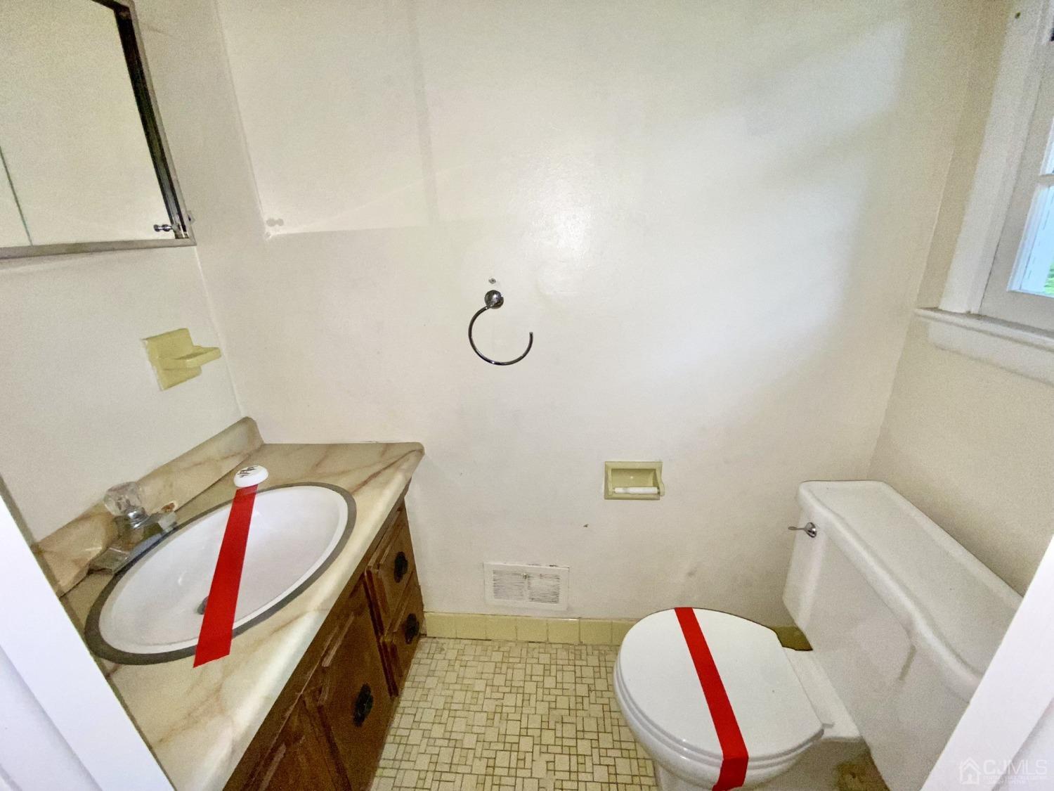 12 Federal City Road Ewing, NJ 08638 - Photo 8 of 16 a bathroom with a sink and a mirror