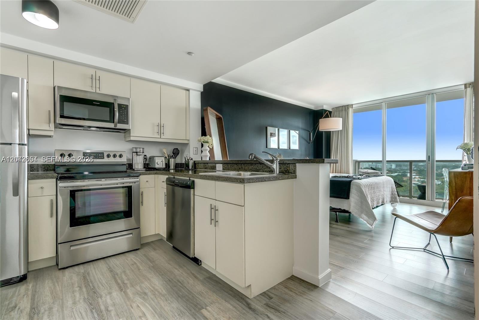 2889 McFarlane Road, Unit 1811 Miami, FL 33133 - Photo 2 of 18 Kitchen from Unit 1