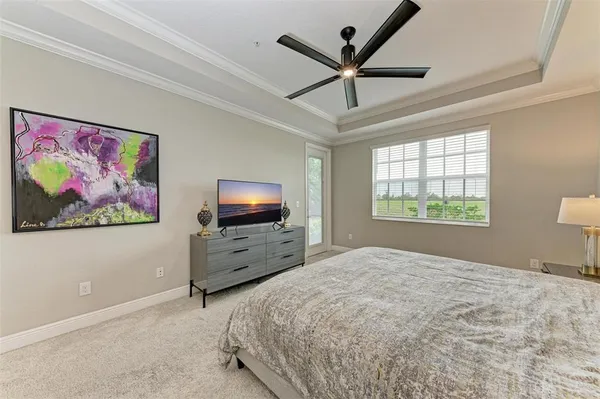 a bedroom with a bed and flat screen tv