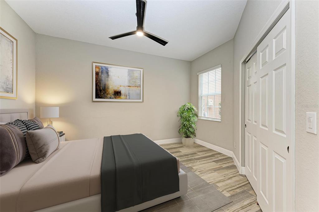 7374 Divot Loop Bradenton, FL 34202 - Photo 19 of 43 a living room with a bed furniture and a window
