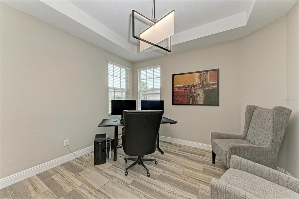 7374 Divot Loop Bradenton, FL 34202 - Photo 24 of 43 a view of a livingroom with workspace and a couch