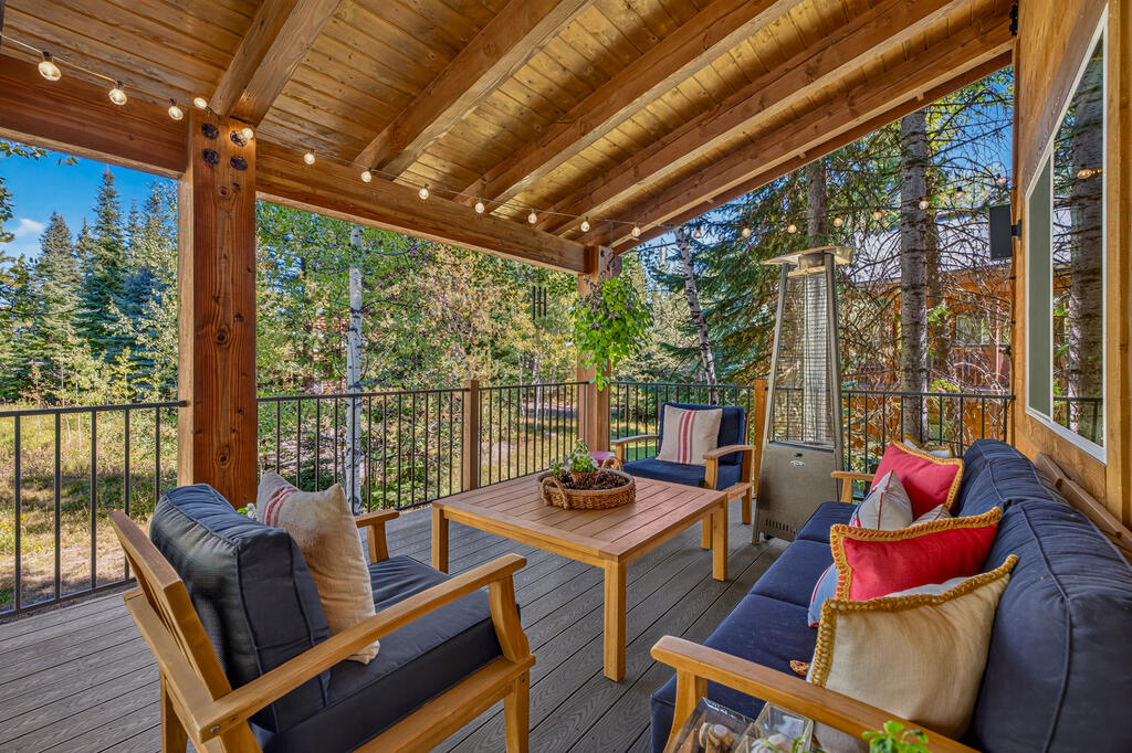 1019 Bitterroot Drive McCall, ID 83638 - Photo 13 of 49 The Covered deck., Located off of the Great Room, this spacious covered outdoor room has a view of a meadow of wildflowers and aspens.