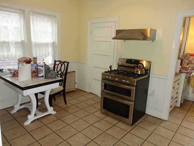 20 Langham Road Providence, RI 02906 - Photo 8 of 16 Kitchen. kitchen with butler s pantry with sink, dishwasher, counter, cabinets.