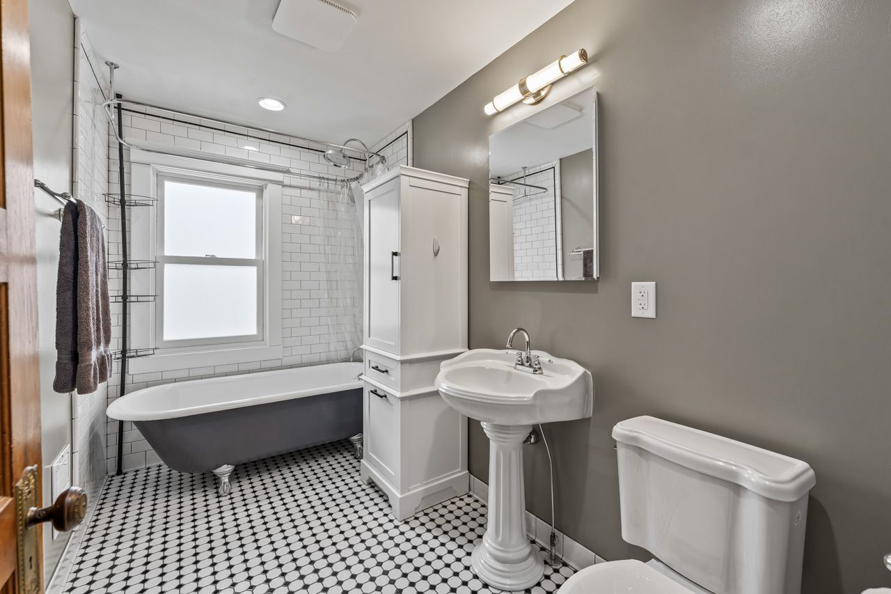 15405 Joliet Road Plainfield, IL 60544 - Photo 20 of 34 a bathroom with a sink a toilet a mirror and shower