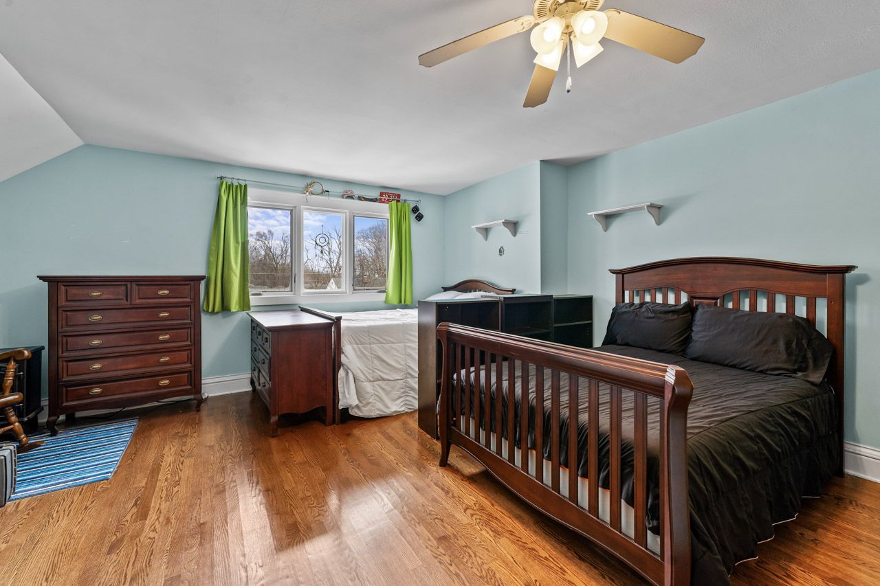 15405 Joliet Road Plainfield, IL 60544 - Photo 21 of 34 a bedroom with furniture and a window