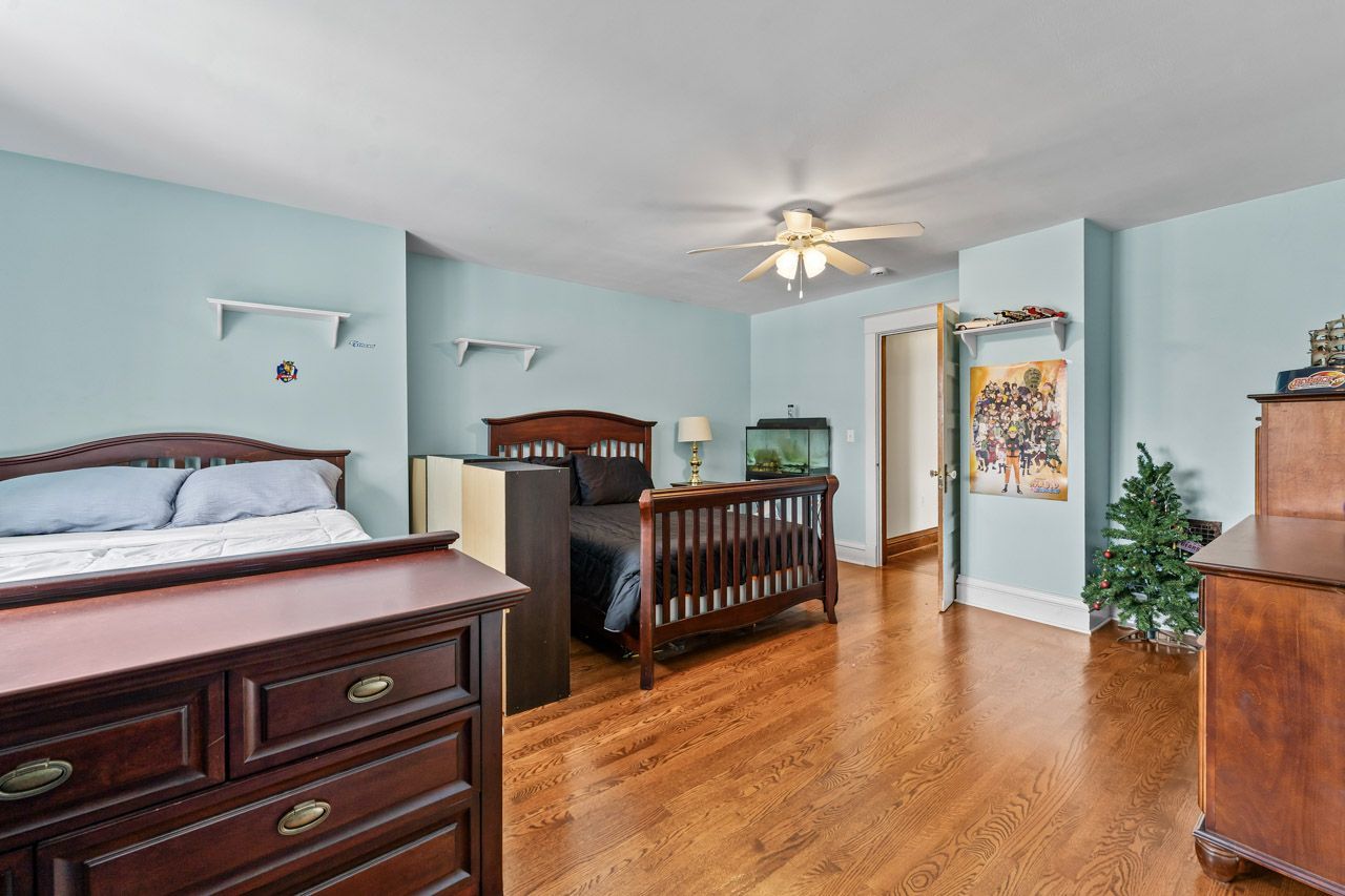 15405 Joliet Road Plainfield, IL 60544 - Photo 22 of 34 a bedroom with furniture and wooden floor