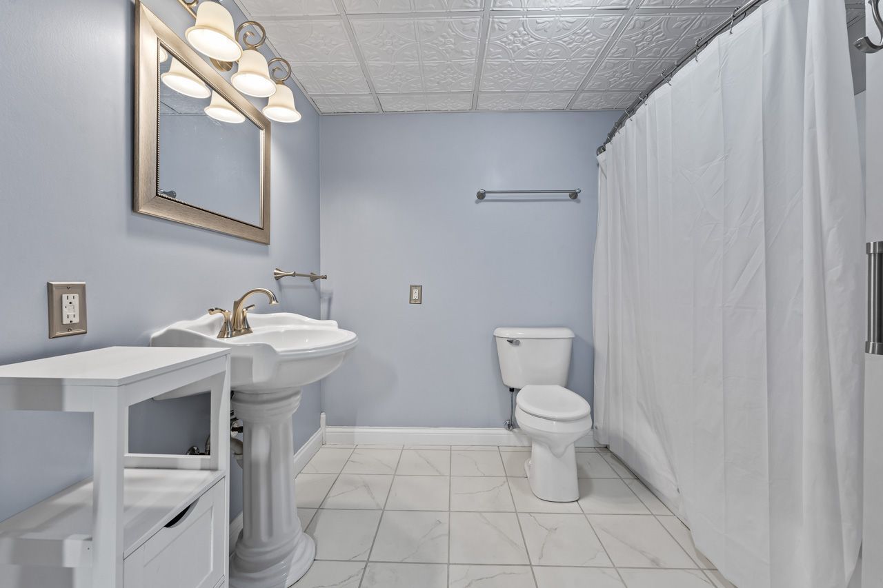 15405 Joliet Road Plainfield, IL 60544 - Photo 23 of 34 a view of a bathroom with a sink and a toilet