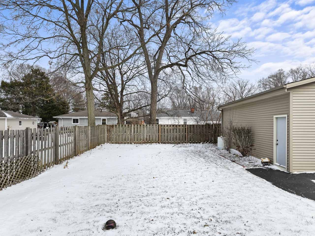 15405 Joliet Road Plainfield, IL 60544 - Photo 29 of 34 a street view covered with snow in front of house
