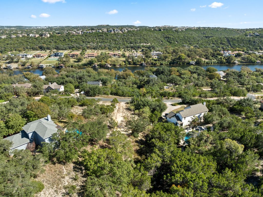 13701 Hunters Pass Austin, TX 78734 - Photo 15 of 34 an aerial view of residential houses with outdoor space and trees