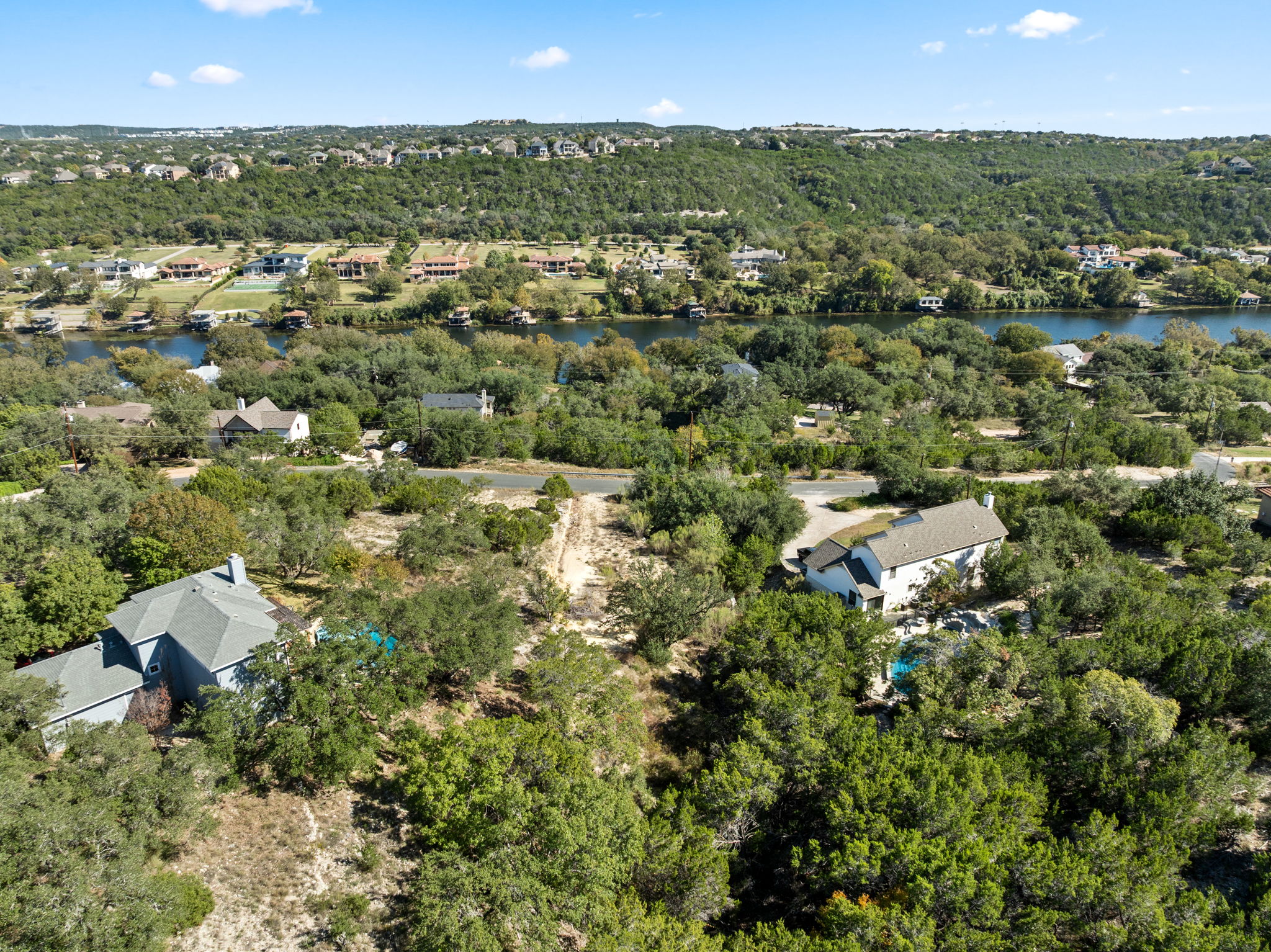 13701 Hunters Pass Austin, TX 78734 - Photo 15 of 33 an aerial view of residential houses with outdoor space and trees