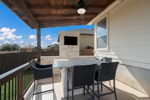 a balcony view with a seating space