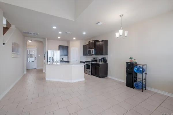 a view of a kitchen with microwave and cabinets