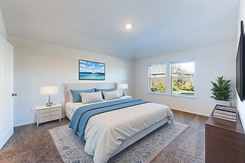 2101 Brisbon Street Fate, TX 75189 - Photo 16 of 39 a bedroom with bed and a potted plant