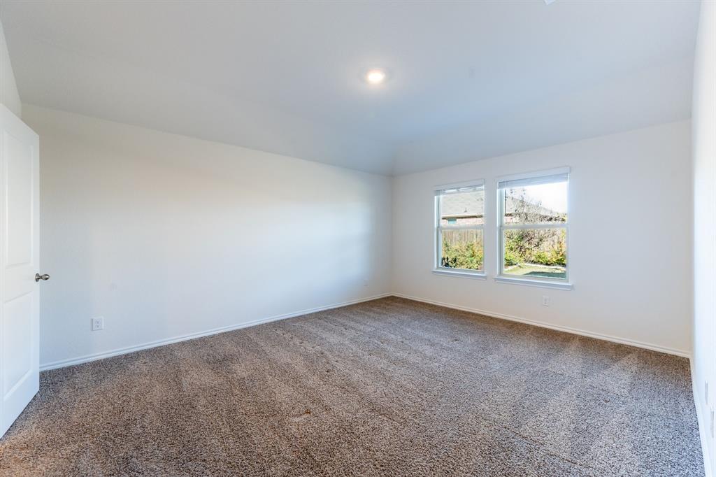 2101 Brisbon Street Fate, TX 75189 - Photo 17 of 39 an empty room with windows