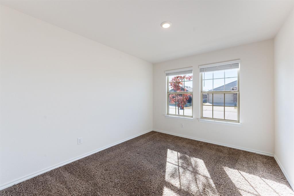 2101 Brisbon Street Fate, TX 75189 - Photo 24 of 39 an empty room with a window