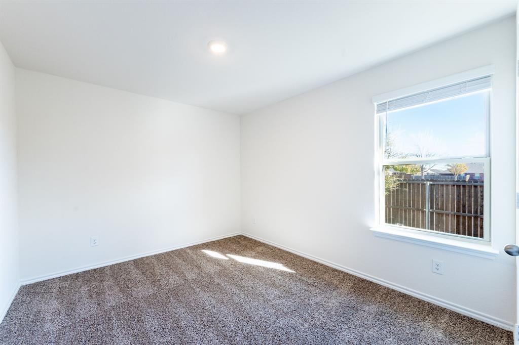 2101 Brisbon Street Fate, TX 75189 - Photo 27 of 39 an empty room with a window