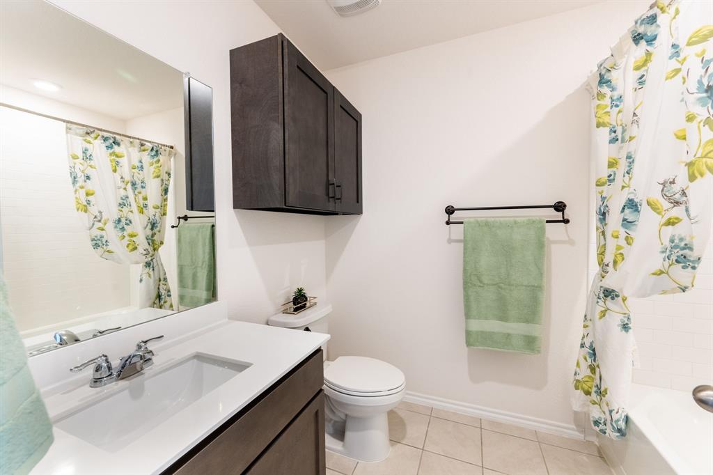 2101 Brisbon Street Fate, TX 75189 - Photo 28 of 39 a bathroom with a sink toilet and shower