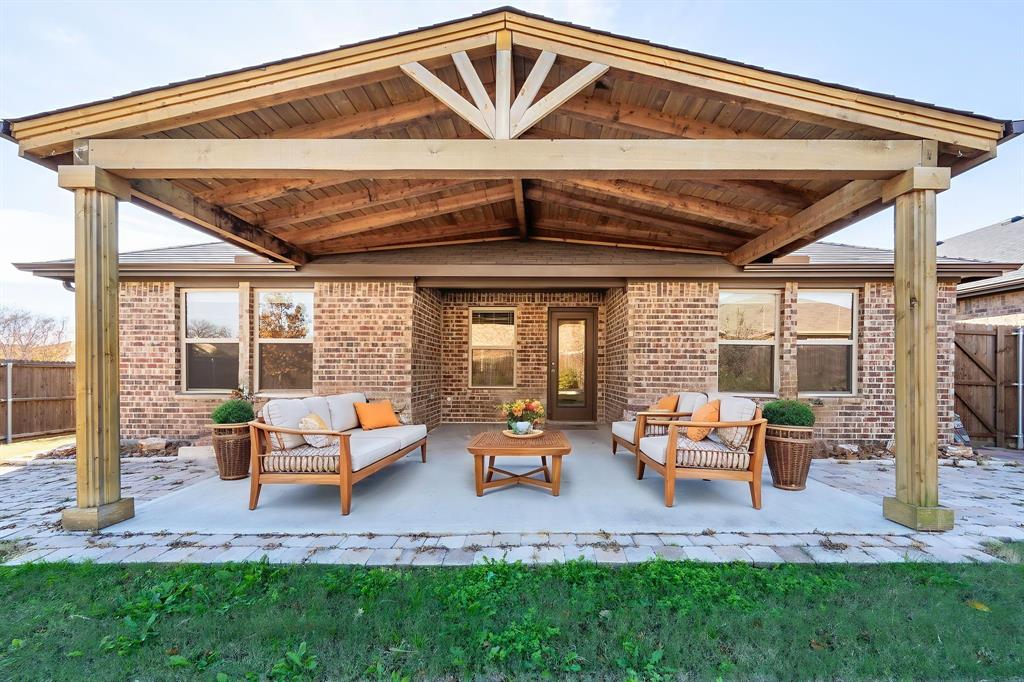 2101 Brisbon Street Fate, TX 75189 - Photo 32 of 39 a backyard of a house with table and chairs