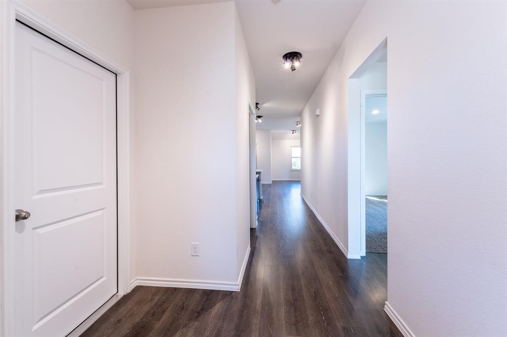 2101 Brisbon Street Fate, TX 75189 - Photo 6 of 39 a view of a hallway with wooden floor