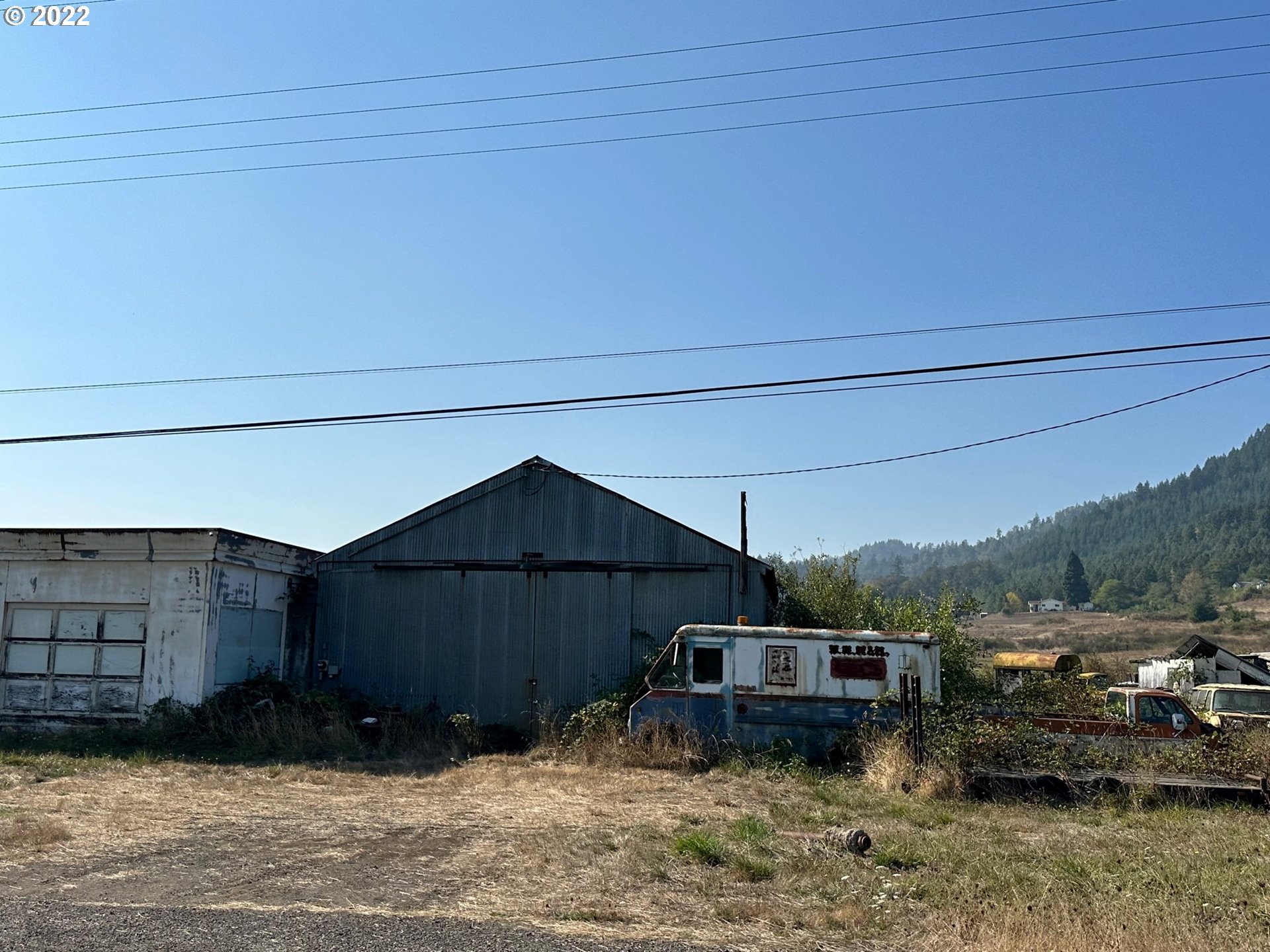 3132 Eagle Valley Road Yoncalla, OR 97499 - Photo 2 of 32 a view of a house with a yard