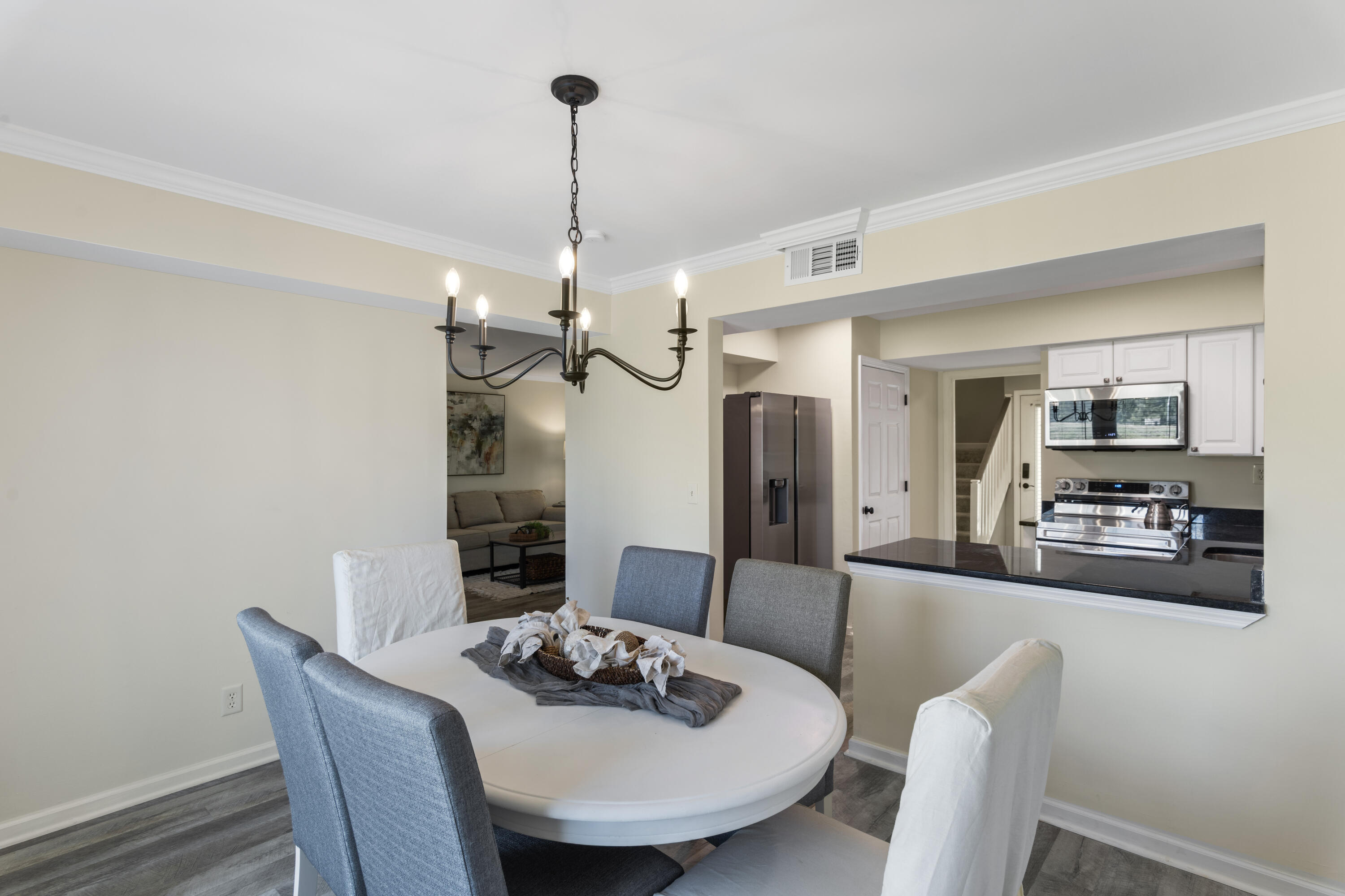 4300 Bay Point Road, Unit 402 Panama City Beach, FL 32408 - Photo 15 of 34 a view of a dining room with furniture
