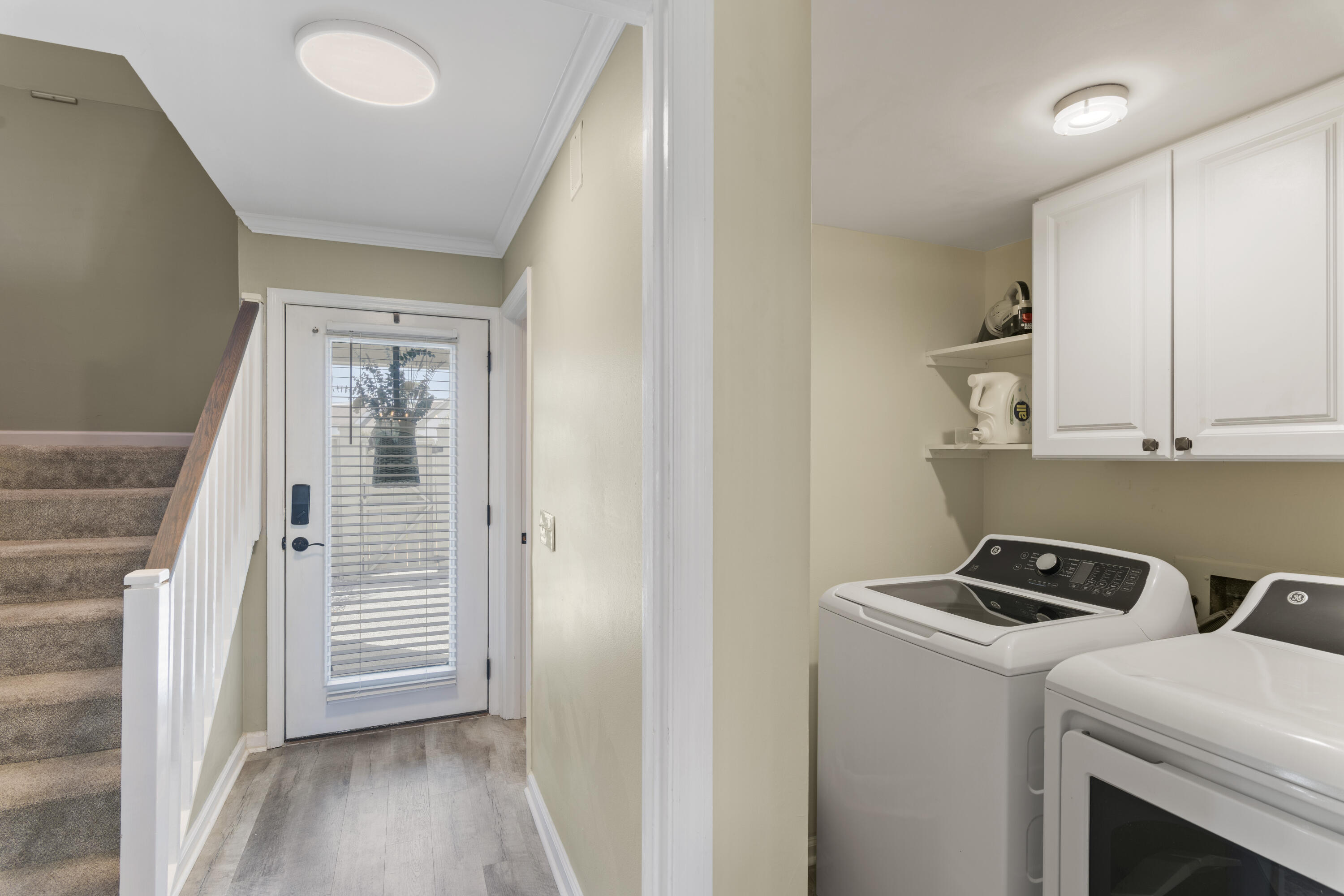 4300 Bay Point Road, Unit 402 Panama City Beach, FL 32408 - Photo 19 of 34 a view of storage and utility room with washer and dryer