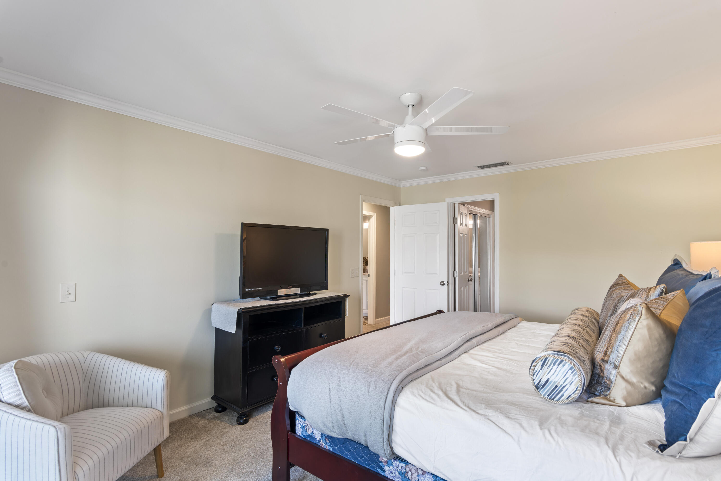 4300 Bay Point Road, Unit 402 Panama City Beach, FL 32408 - Photo 27 of 34 a bedroom with a bed and a television