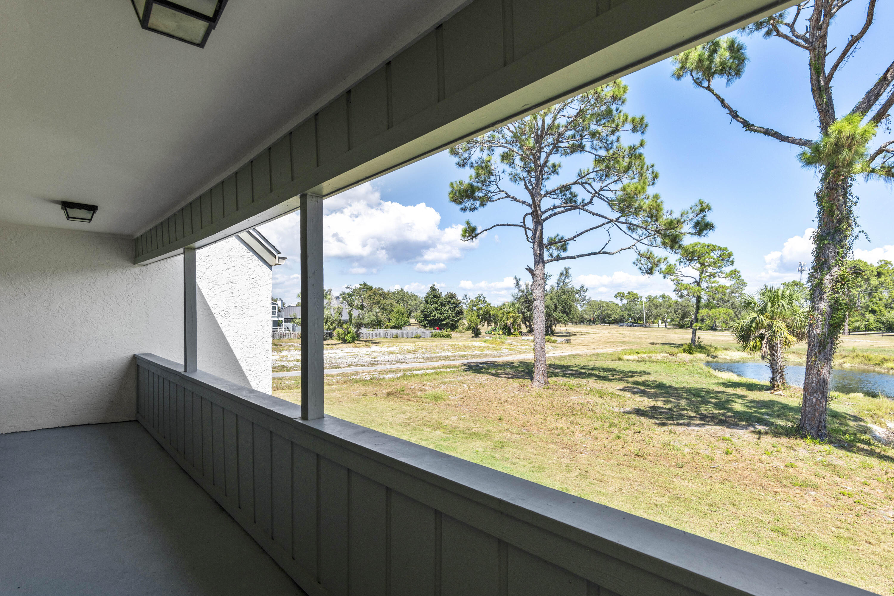 4300 Bay Point Road, Unit 402 Panama City Beach, FL 32408 - Photo 30 of 34 a view of an outdoor space with a lake view