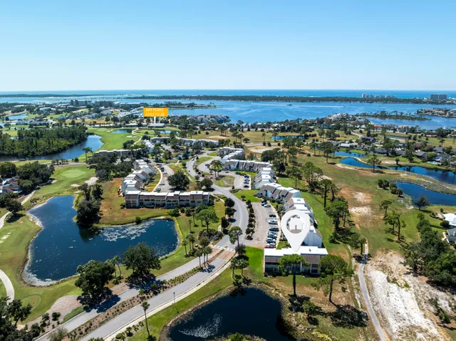 an aerial view of residential building and lake