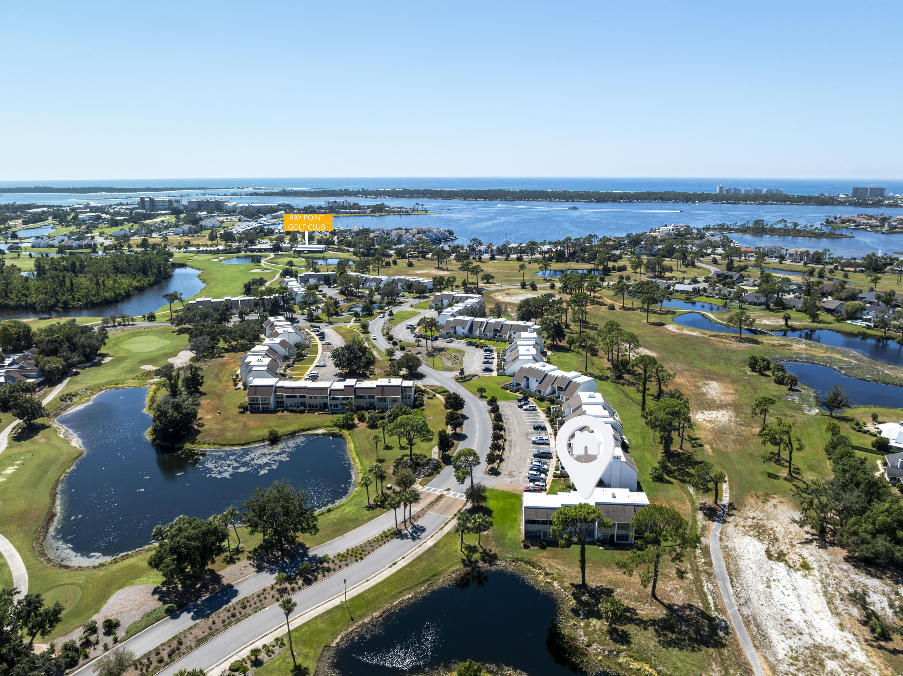 4300 Bay Point Road, Unit 402 Panama City Beach, FL 32408 - Photo 3 of 34 an aerial view of residential building and lake