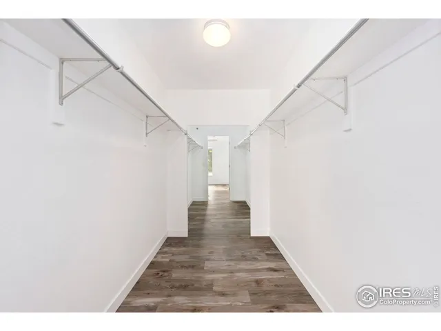 a view of a hallway with stairs