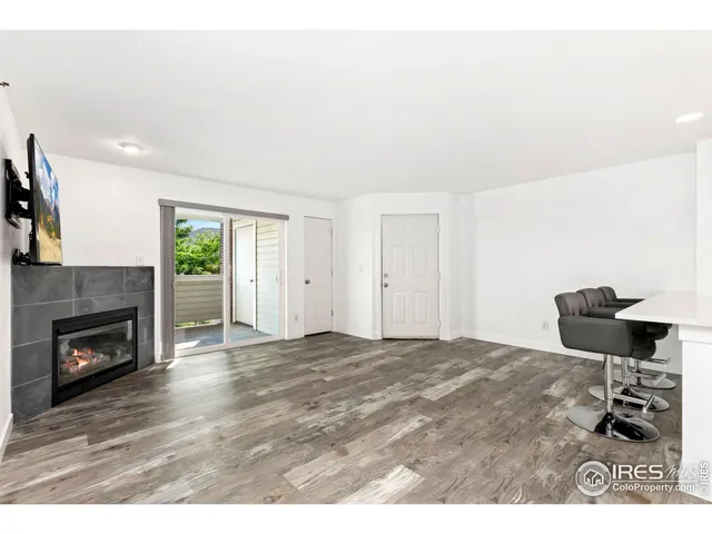 a bedroom with a bed and a fireplace