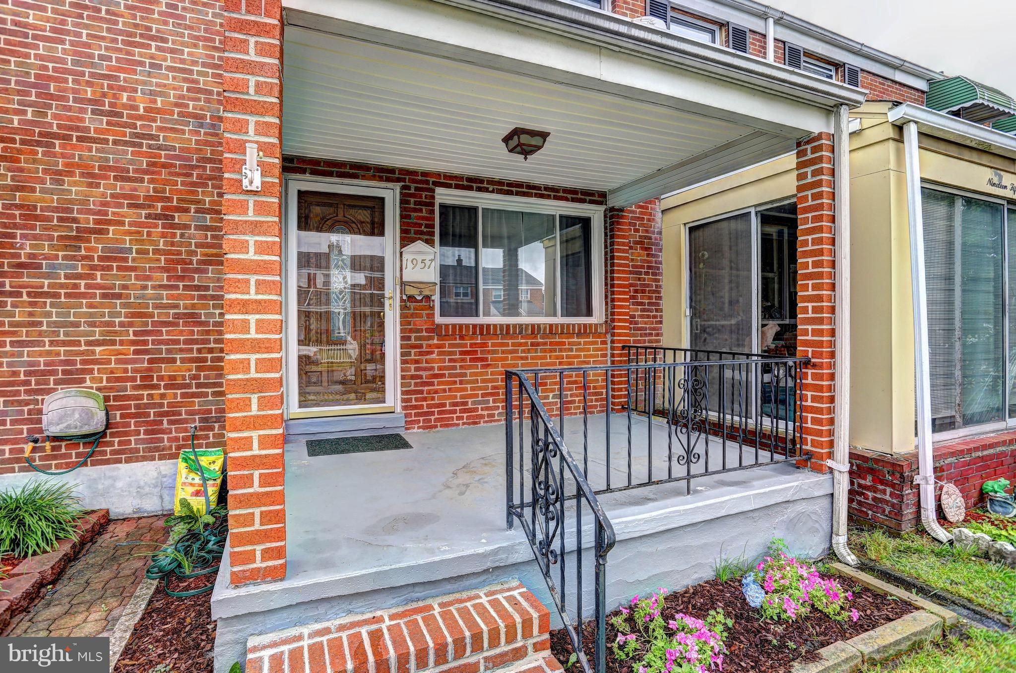 1957 Holborn Road Baltimore, MD 21222 - Photo 1 of 25 a view of a house with wooden floor and bench