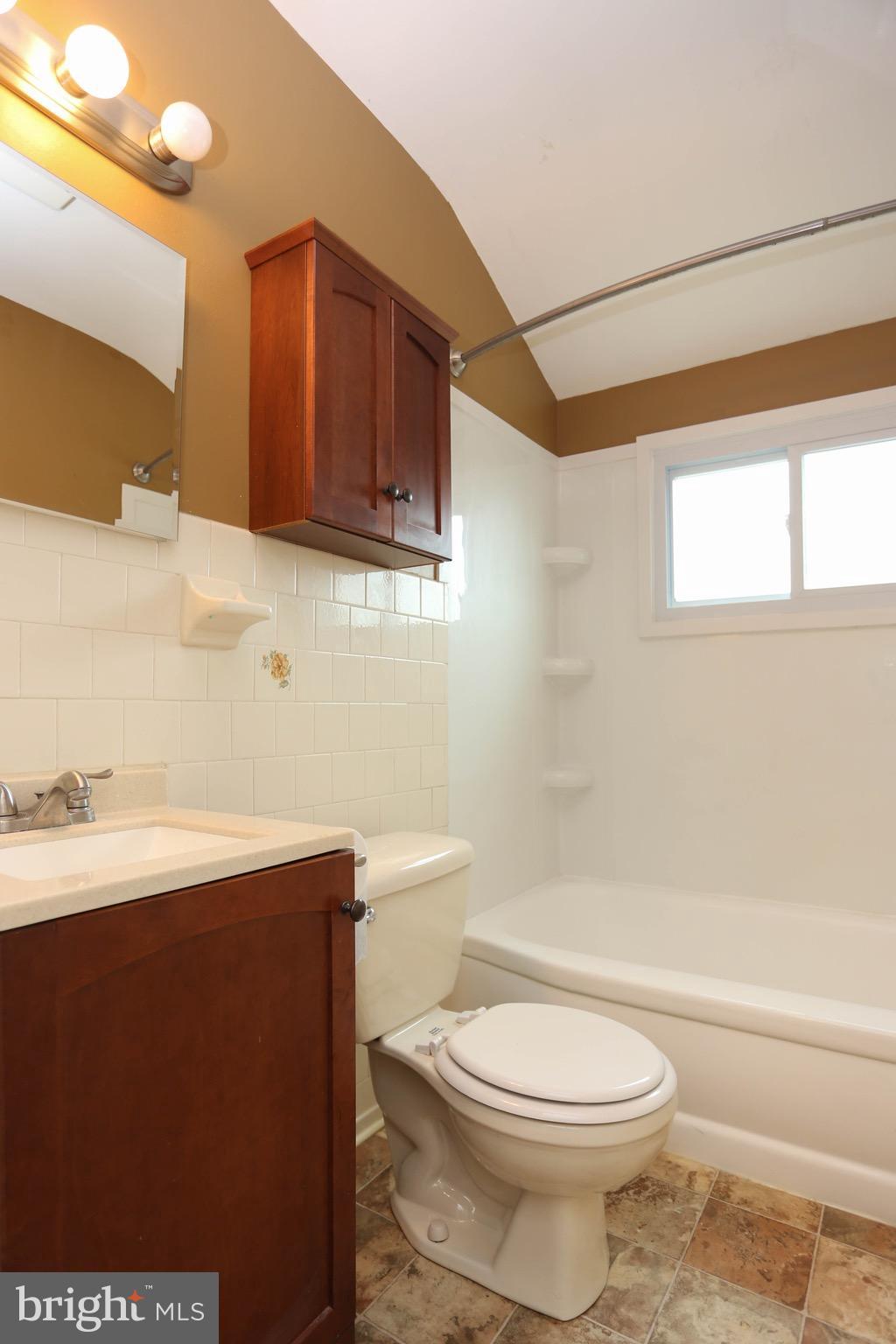 1957 Holborn Road Baltimore, MD 21222 - Photo 18 of 25 a bathroom with a sink a toilet and bathtub