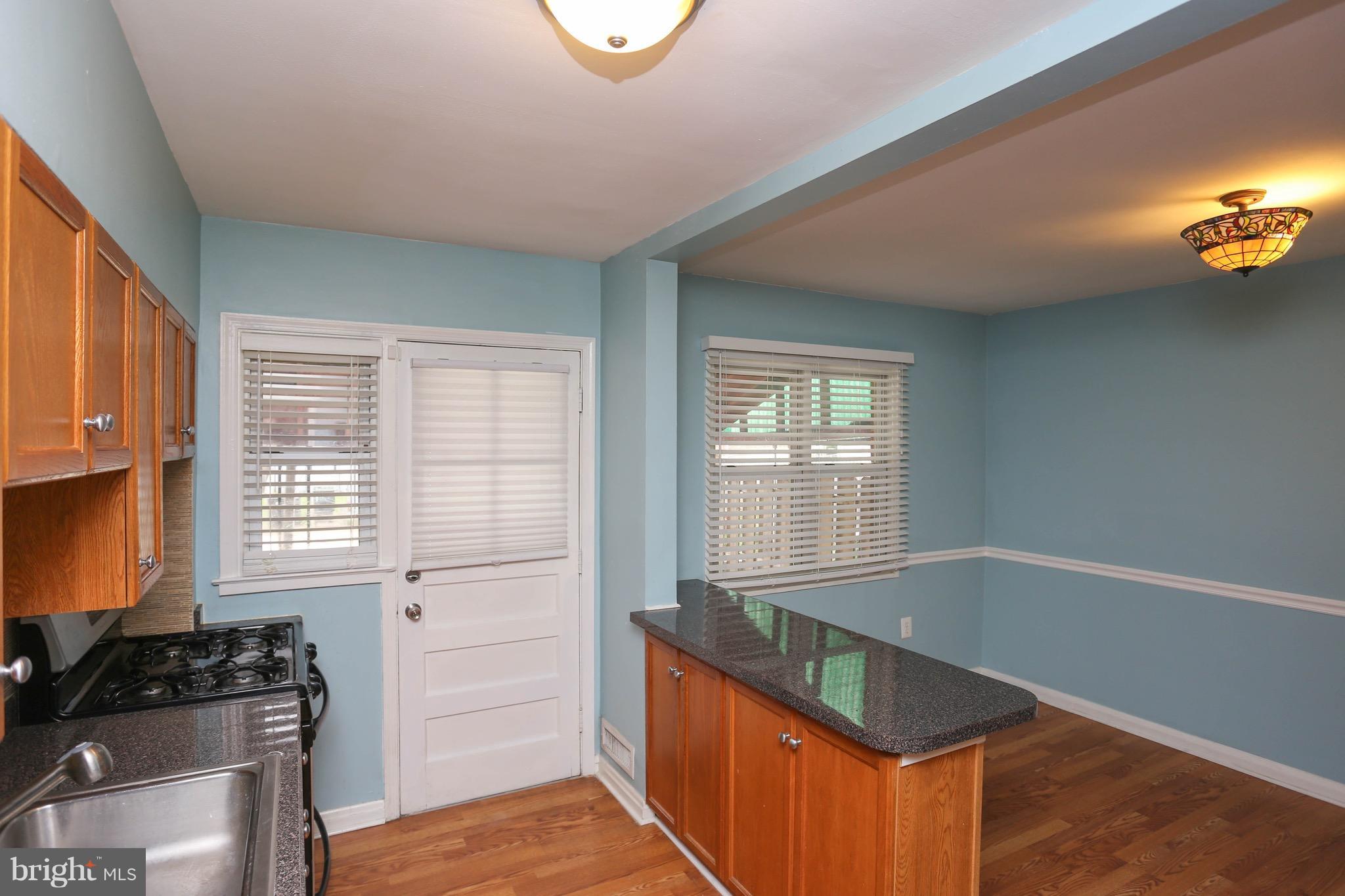 1957 Holborn Road Baltimore, MD 21222 - Photo 10 of 25 a kitchen with granite countertop a stove and a sink