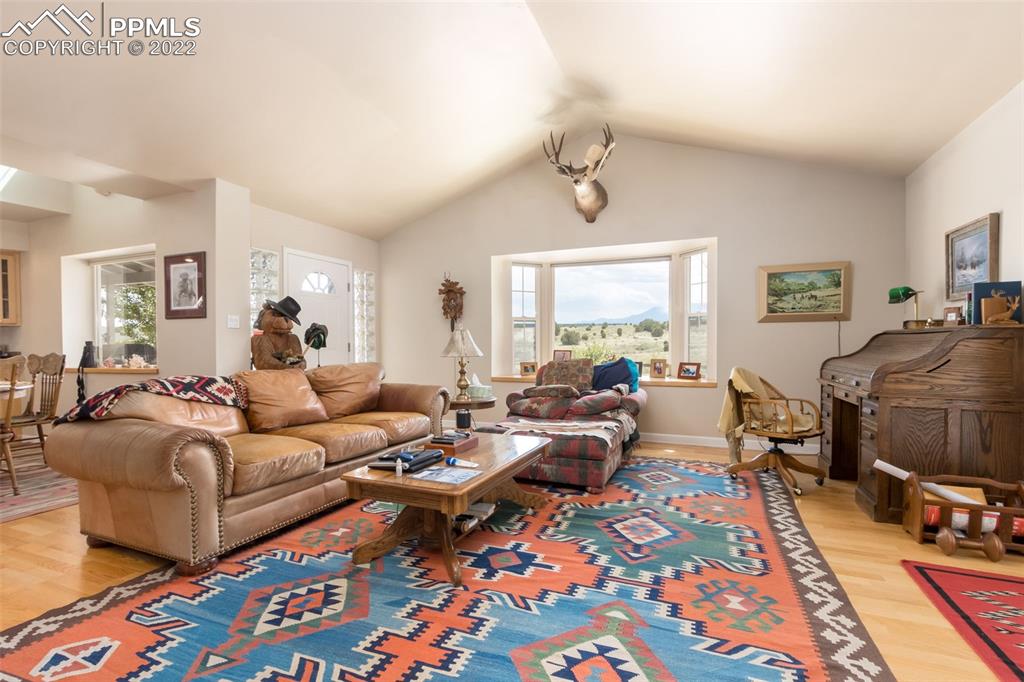 6670 Zercher Road Beulah, CO 81023 - Photo 12 of 41 a living room with furniture and a flat screen tv