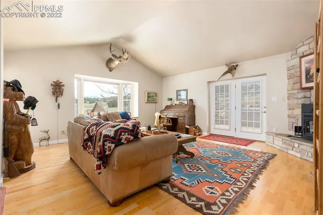 a bed room with a bed and a large window