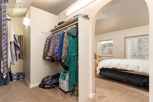 a bed room with a bed and a window