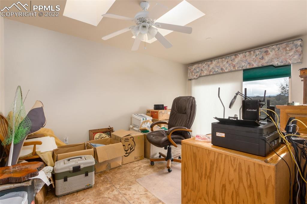 6670 Zercher Road Beulah, CO 81023 - Photo 28 of 41 a room with gym equipment and a large window